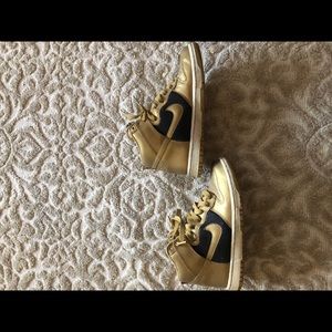 Gold and Black limited edition Nike’s.